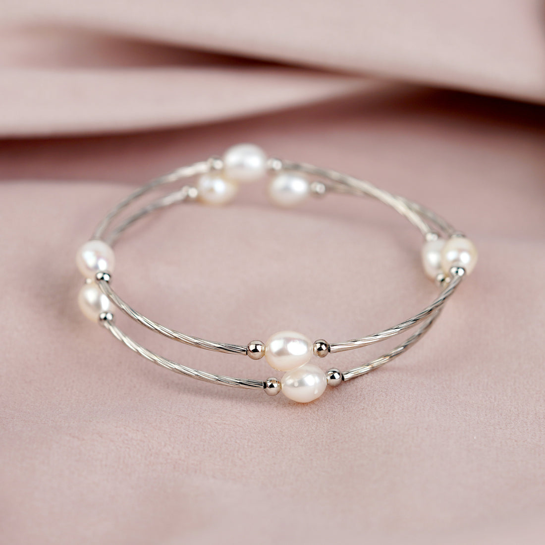 A bracelet adorned with white pearls - Krishna Jewellers Pearls and Gems
