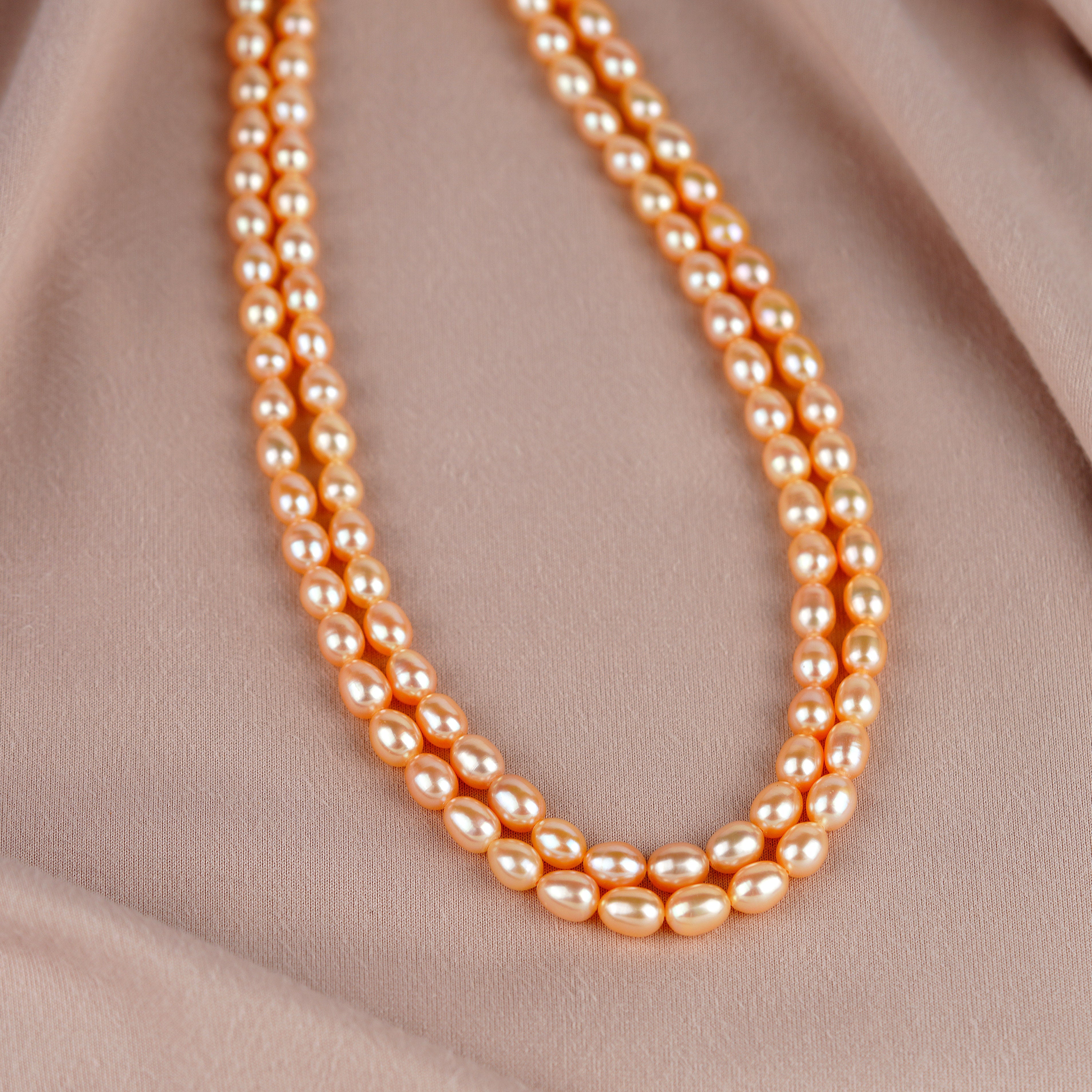 Double-strand pearl necklace in peach color - Krishna Jewellers Pearls and Gems