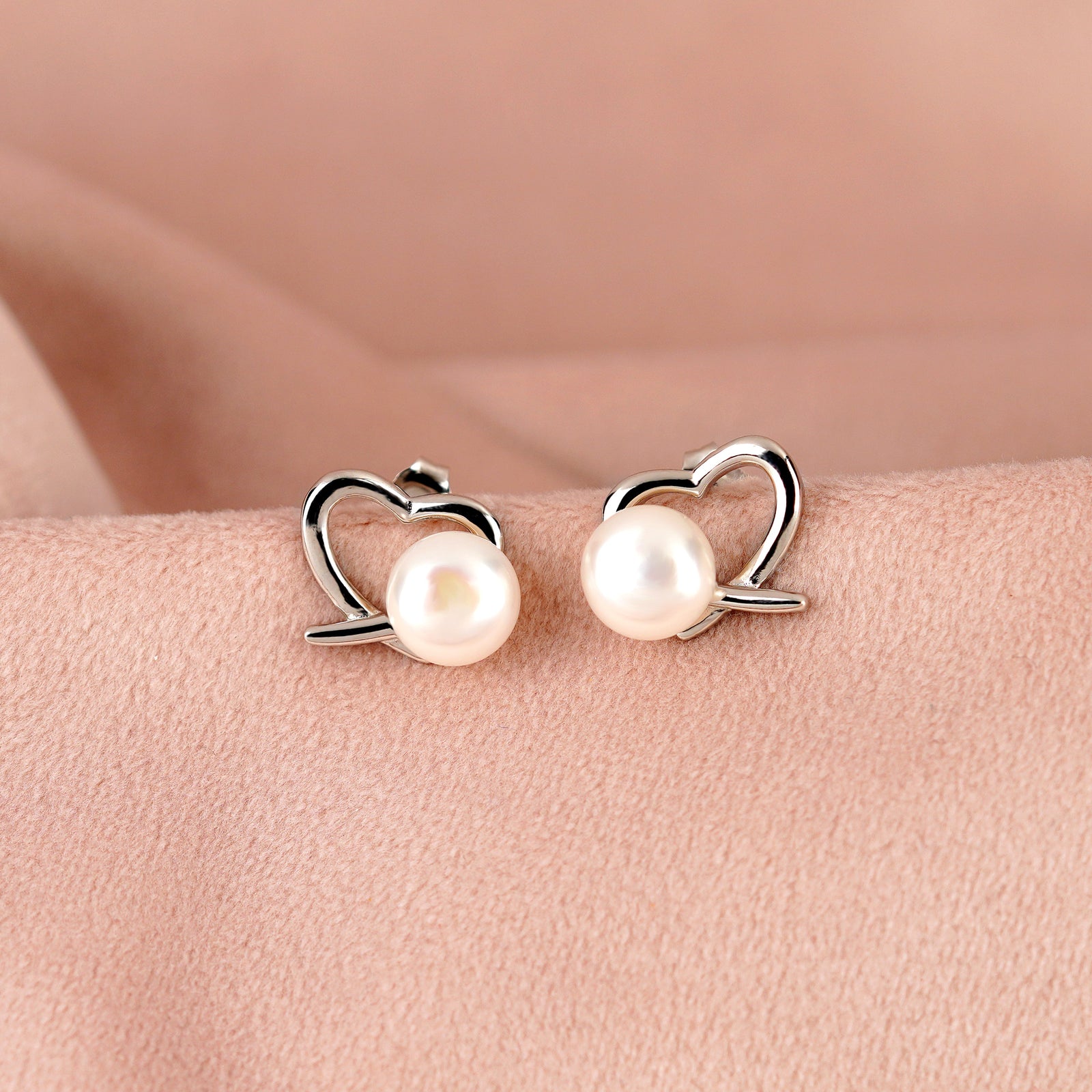 Heartfelt Pearl stud Earrings in Silver Alloy - Krishna Jewellers Pearls and Gems