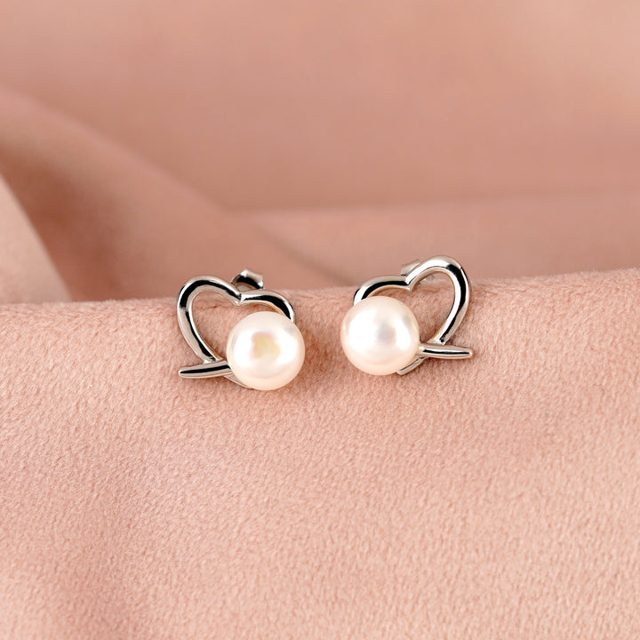 Heartfelt Pearl stud Earrings in Silver Alloy - Krishna Jewellers Pearls and Gems