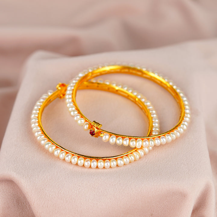 Elegant White Pearl Bangles with Sparkling Red Stones - Krishna Pearls