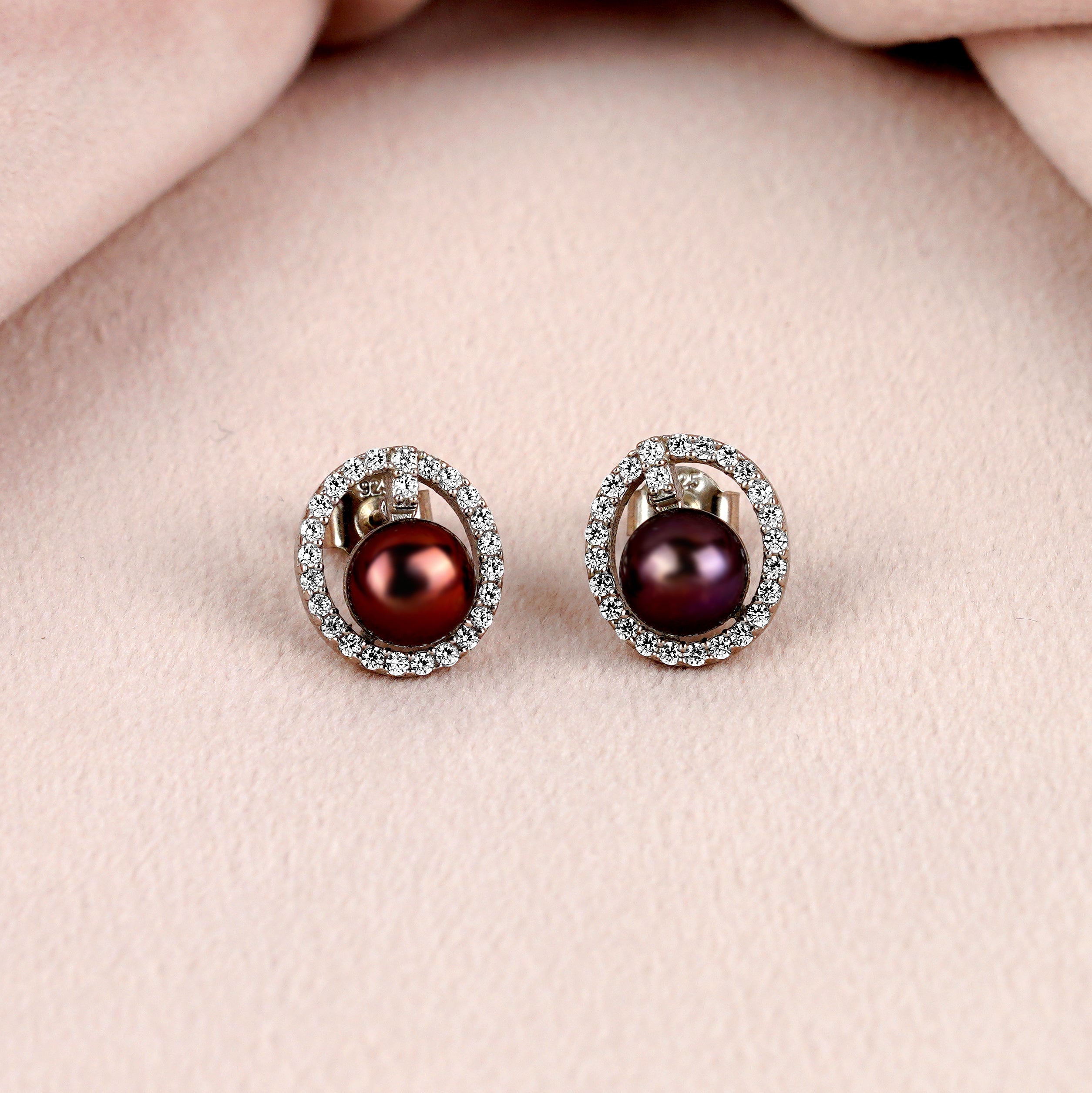 Captivating stud earrings set with a fresh water pearl and CZ stones - Krishna Jewellers Pearls and Gems