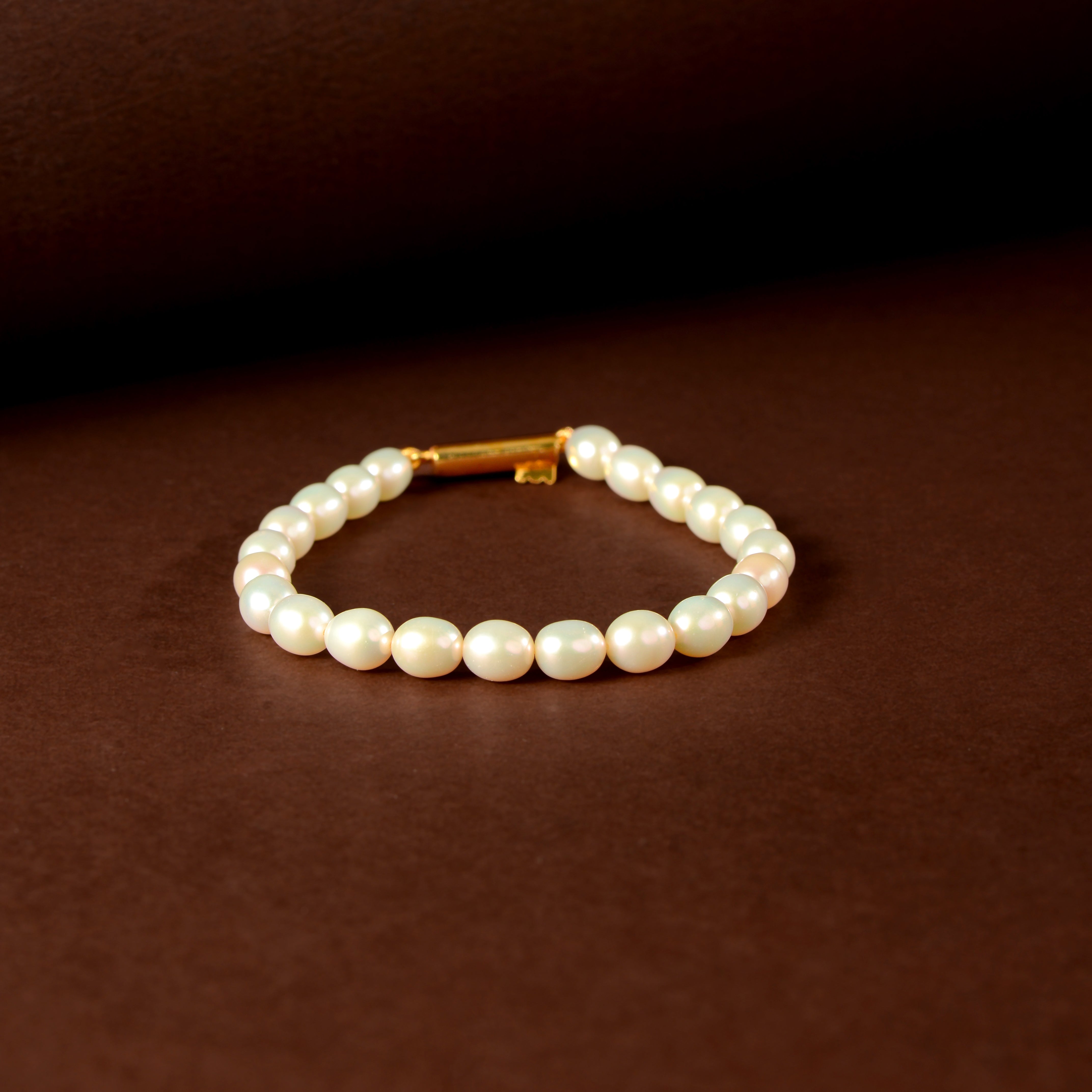 Ivory Link Pearl Bracelet ( Fresh water Pearls With Gold Polished Clip In Silver )