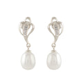 Silver paan leaf earrings with pearls.