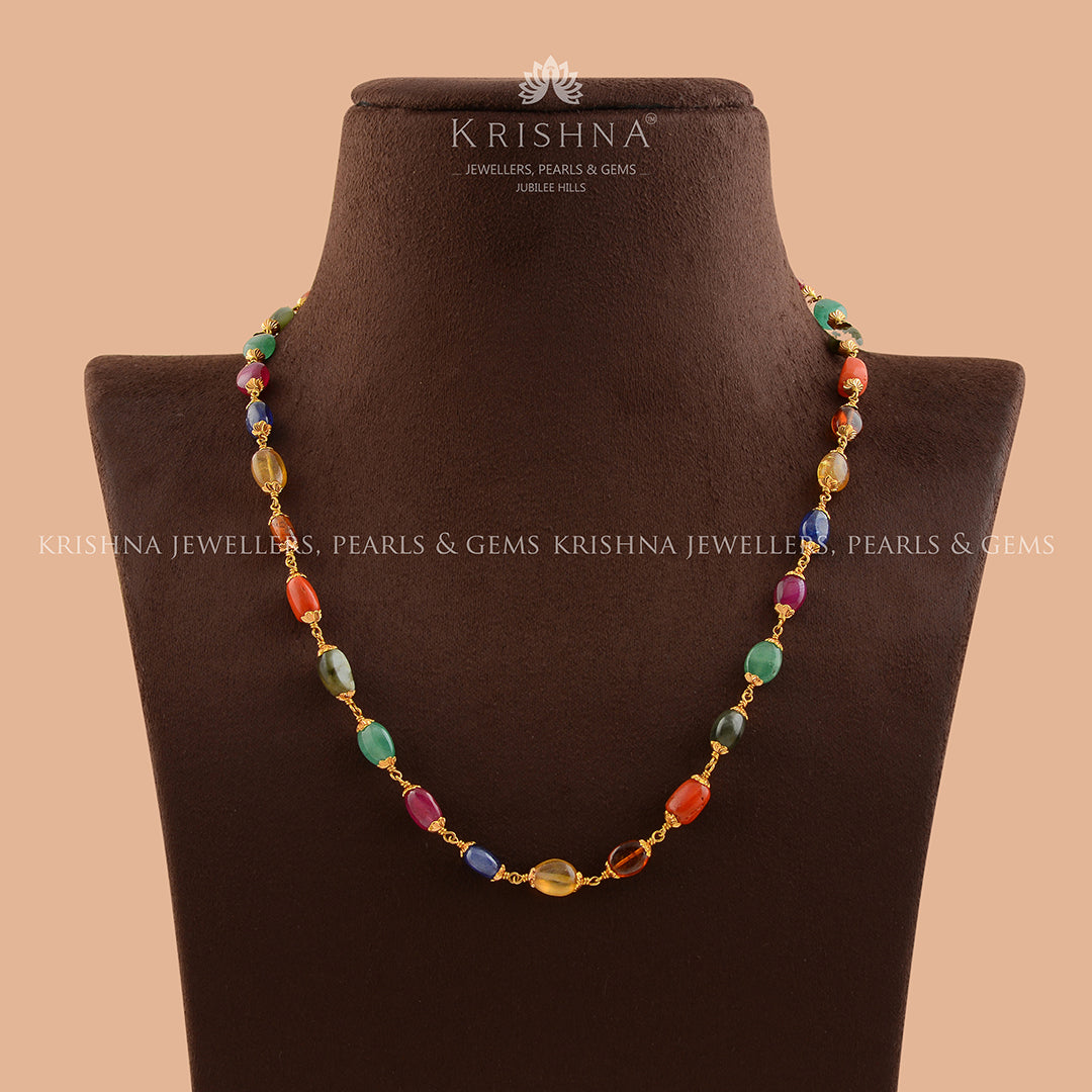 Celestial Sparkle: Navaratna Gold Necklace - Krishna Jewellers Pearls and Gems