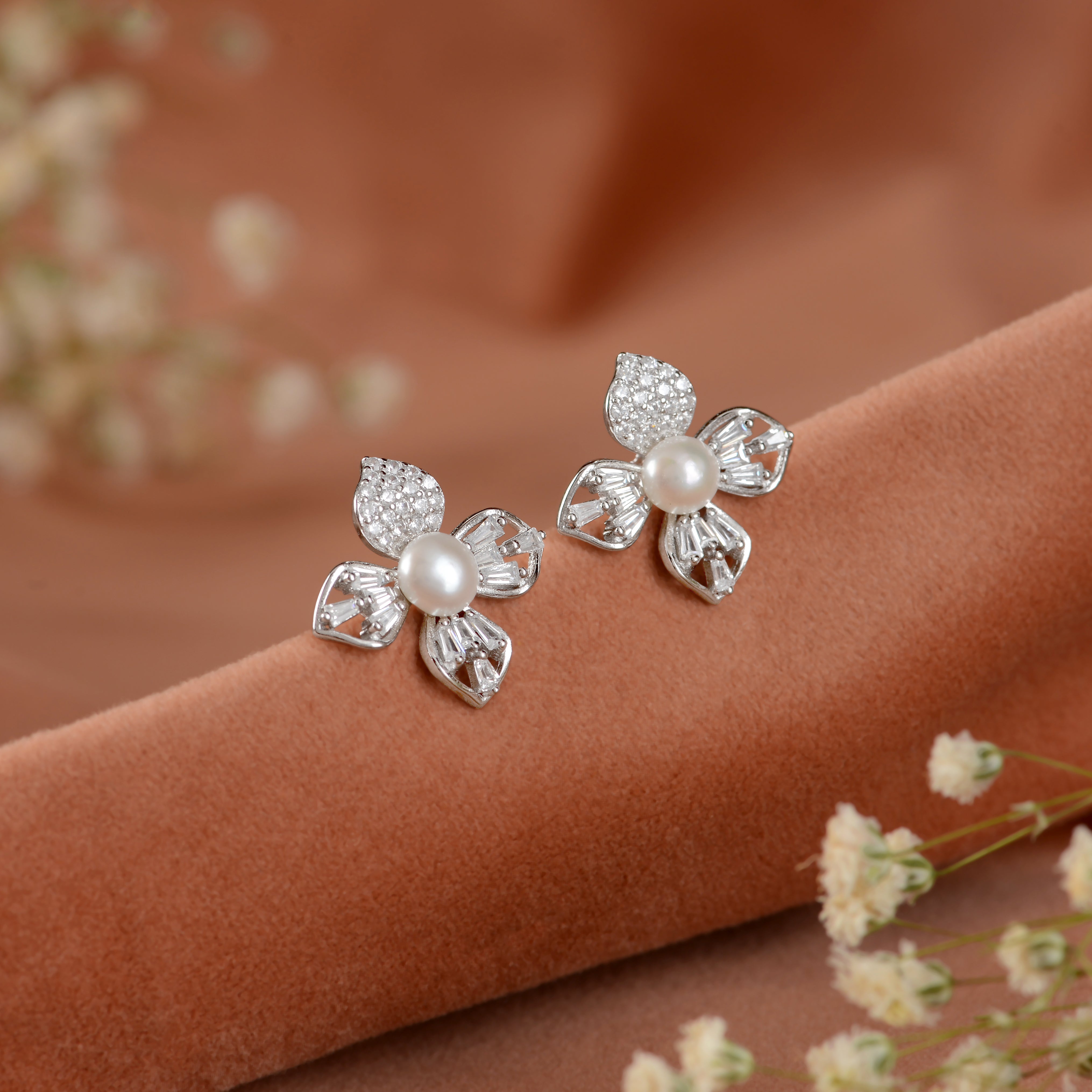 Pearl stud earrings in jasmine petal style.
