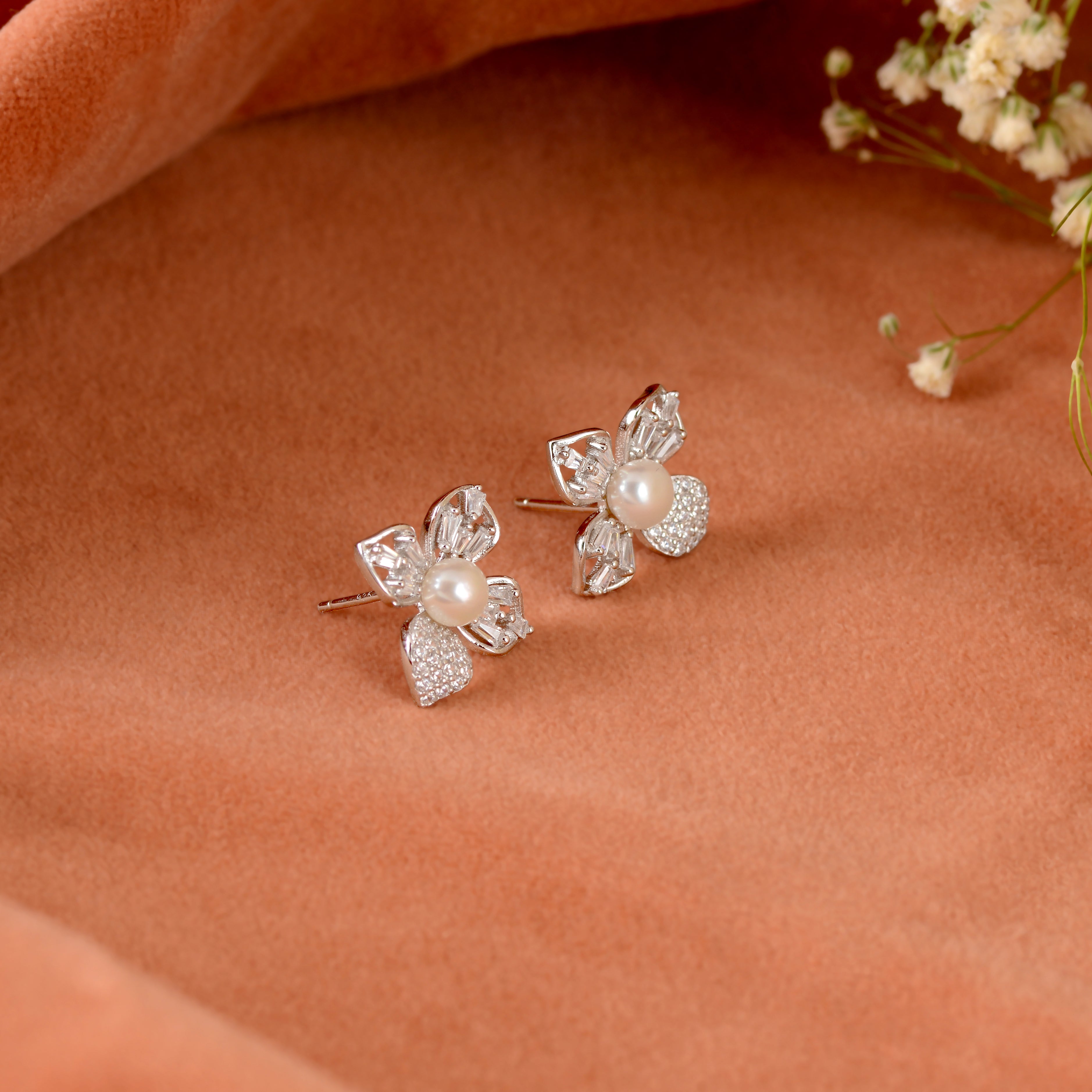 Pearl stud earrings in jasmine petal style.
