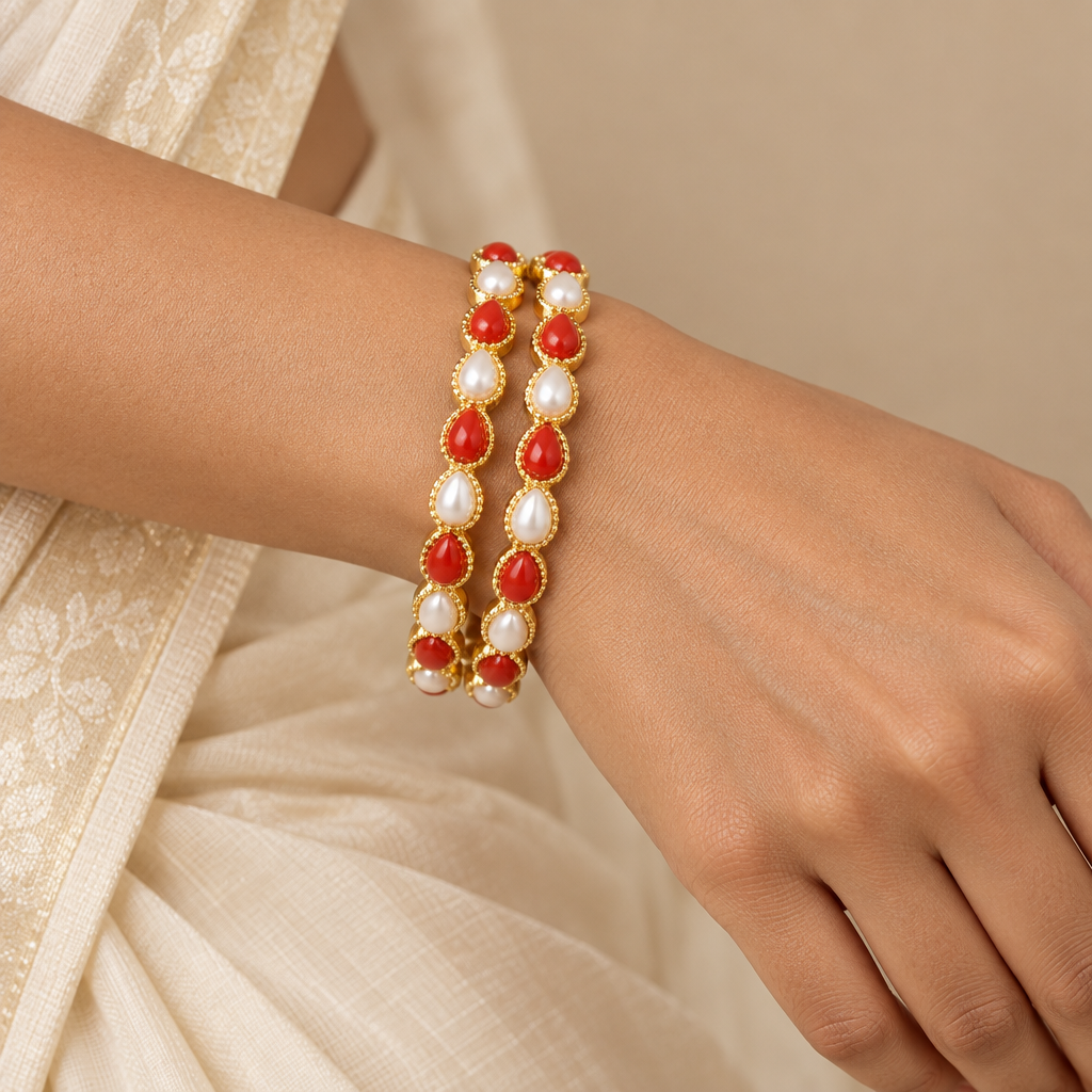 Model wearing the coral and pearl bangles
