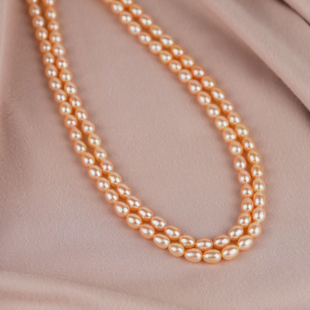 Double-strand pearl necklace in peach color