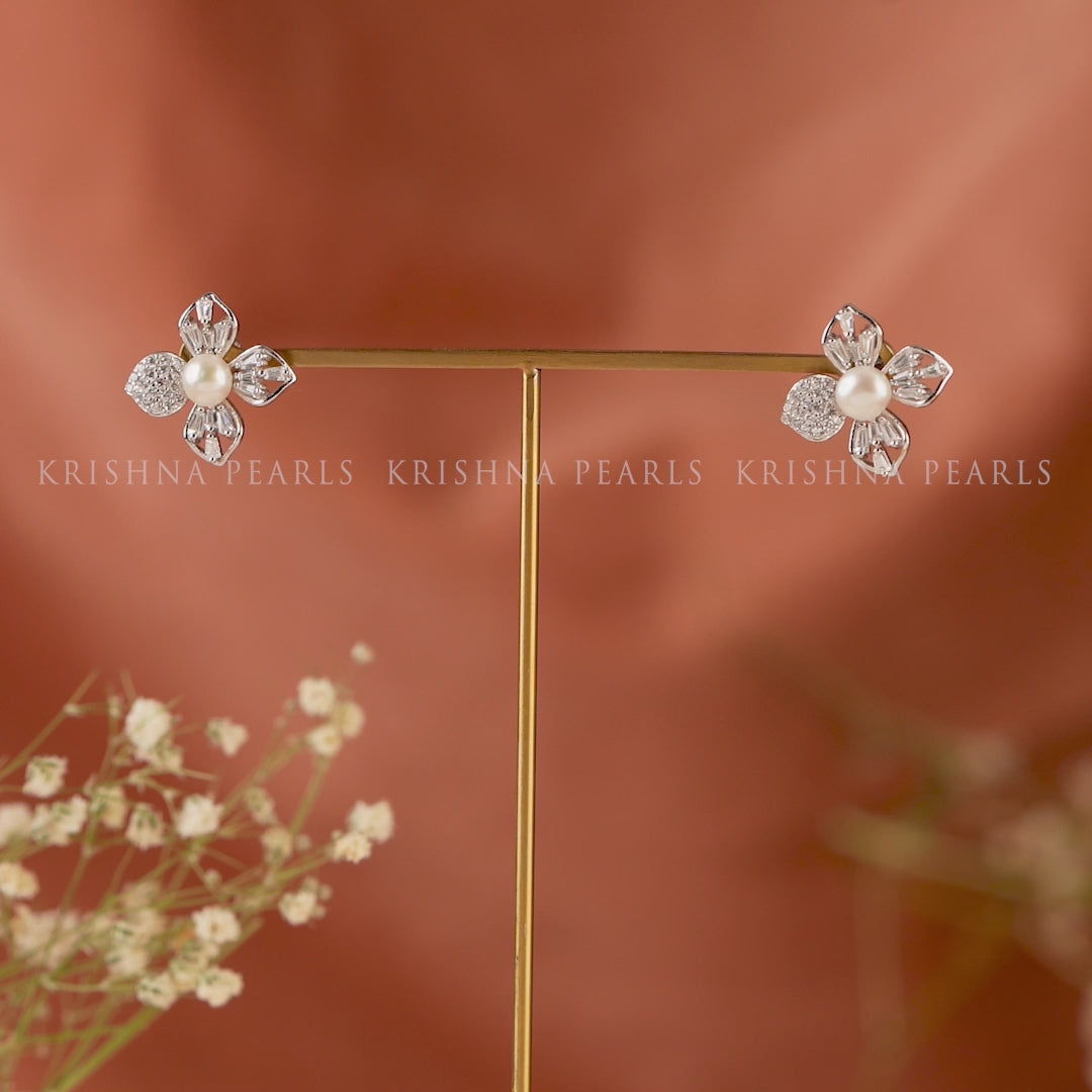 Pearl stud earrings in jasmine petal style.